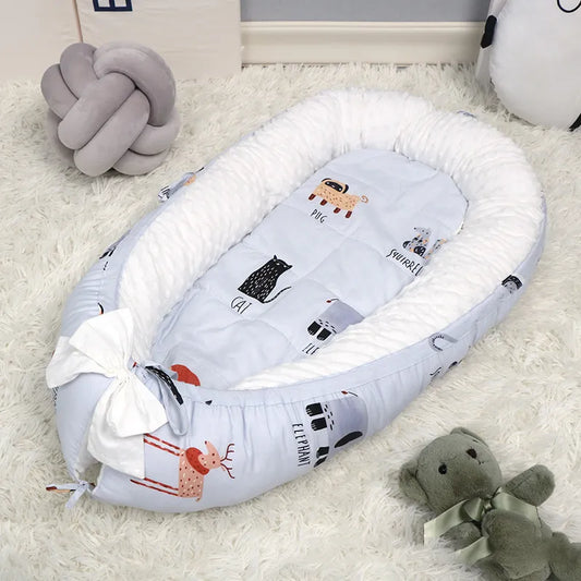 Réducteur de lit bébé bleu