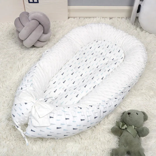 Réducteur de lit cododo sur un tapis
